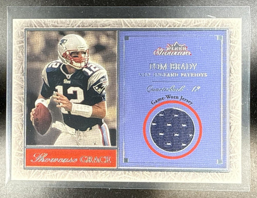 2004 FLEER SHOWCASE TOM BRADY #SG-TB GRACE GAME USED MATERIAL /12 PATCH PATRIOTS